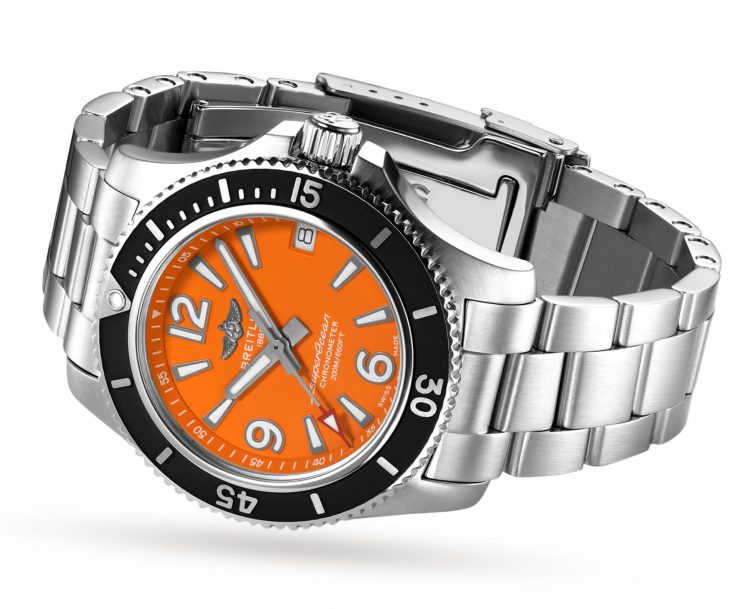The stainless steel fake watch has an orange bezel.