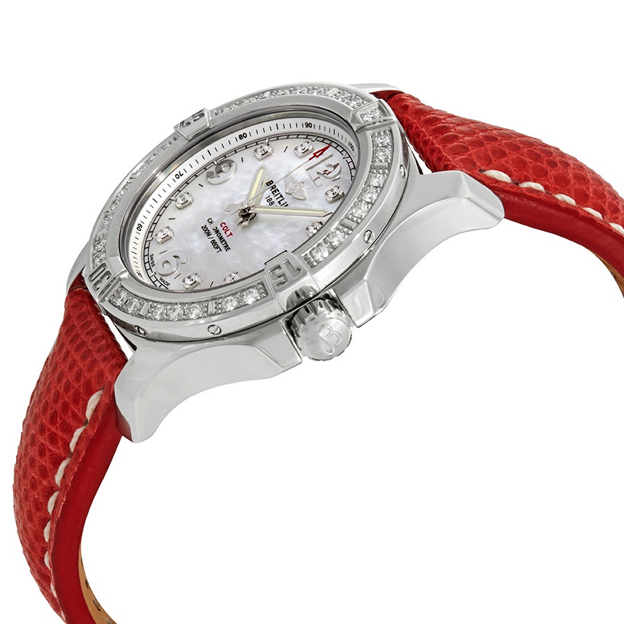 The stainless steel copy watch has a red strap.